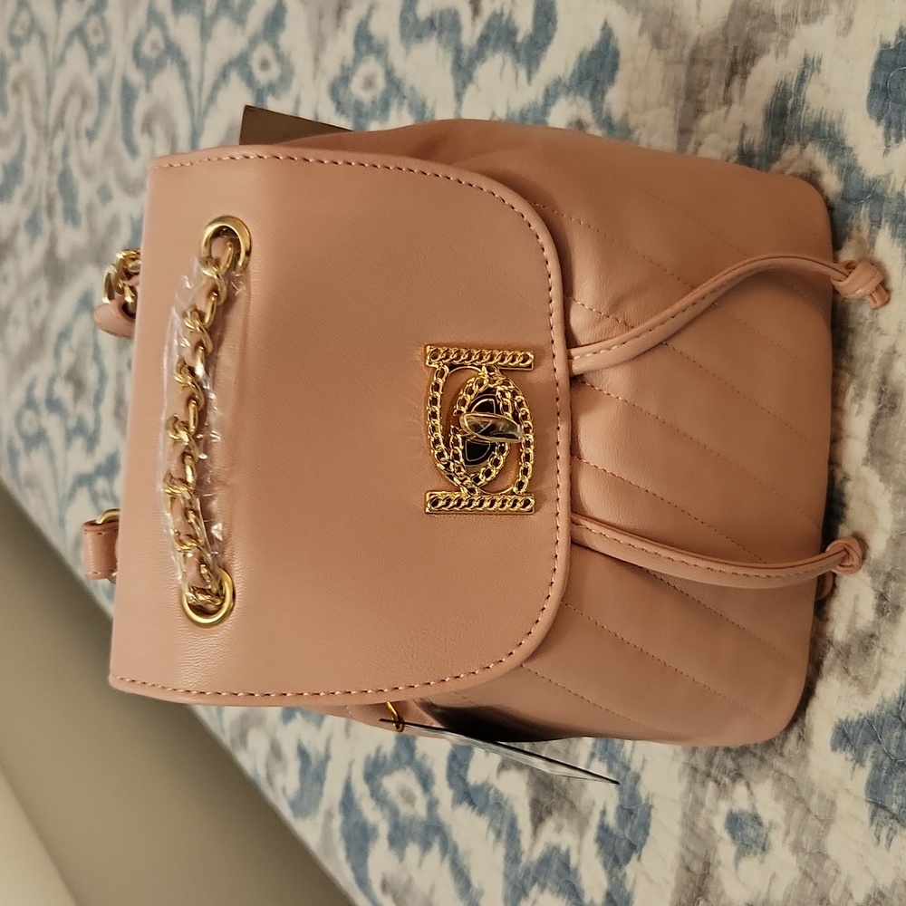 NWT bebe faux leather pink backpack.